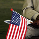 In this 22 May 2006 file photo, Jeneba Kanu, originally from Sierra Leone, holds a US flag while waiting to become a US citizen, during a naturalization ceremony at George Washington's Mount Vernon in Alexandria, Virginia.
JIM WATSON/AFP/Getty Images